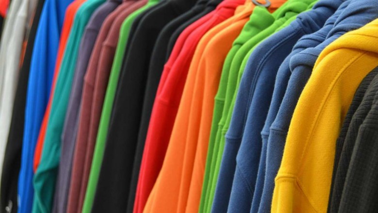 Colorful sweatshirts on a clothing rack