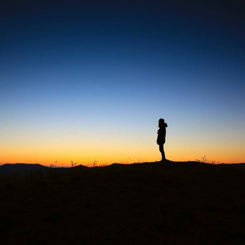 Person standing at Dusk